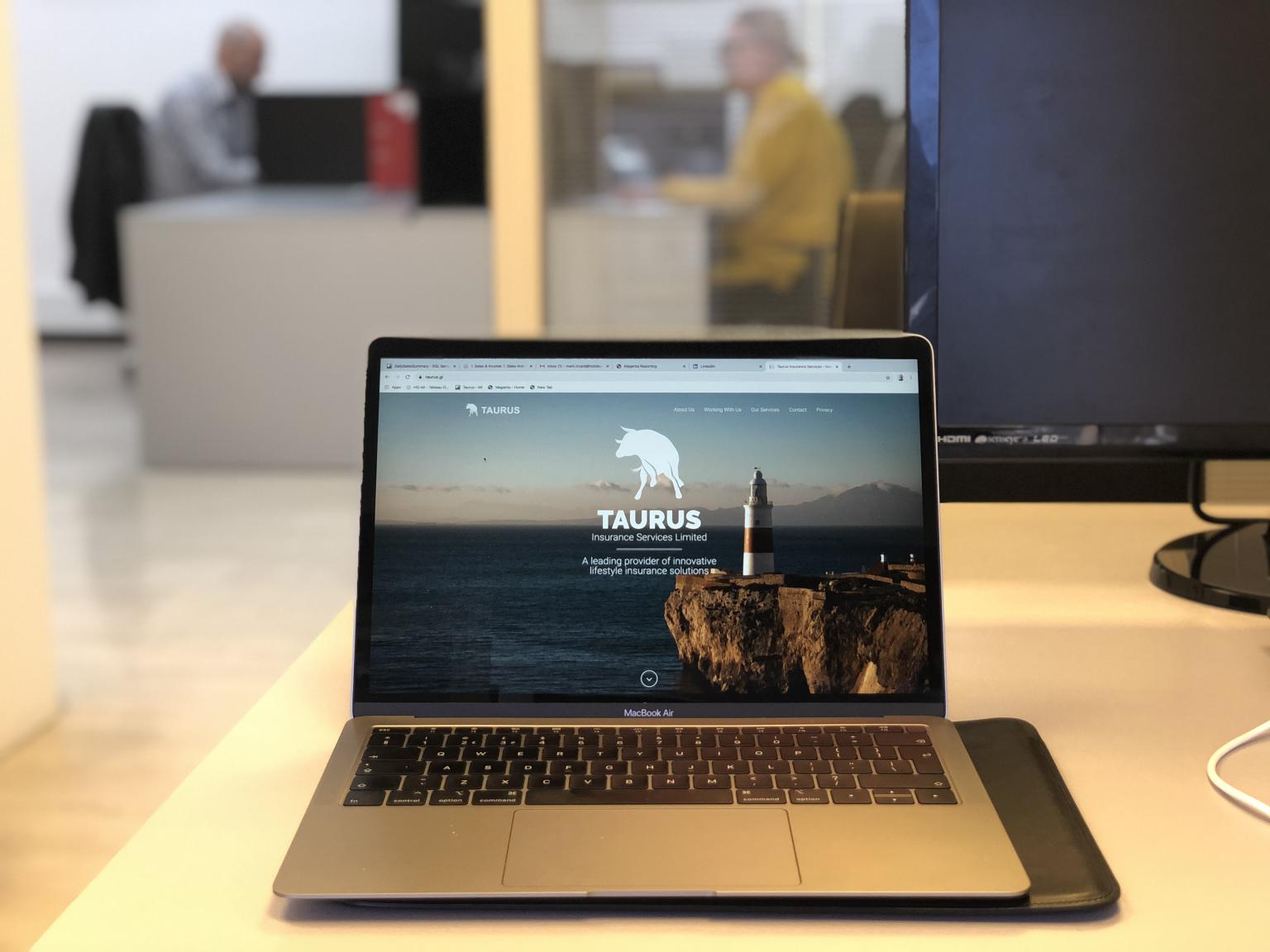 Taurus website open on a MacBook.